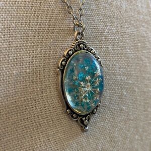 Elegant Silver Pendant Necklace with Blue Accents
